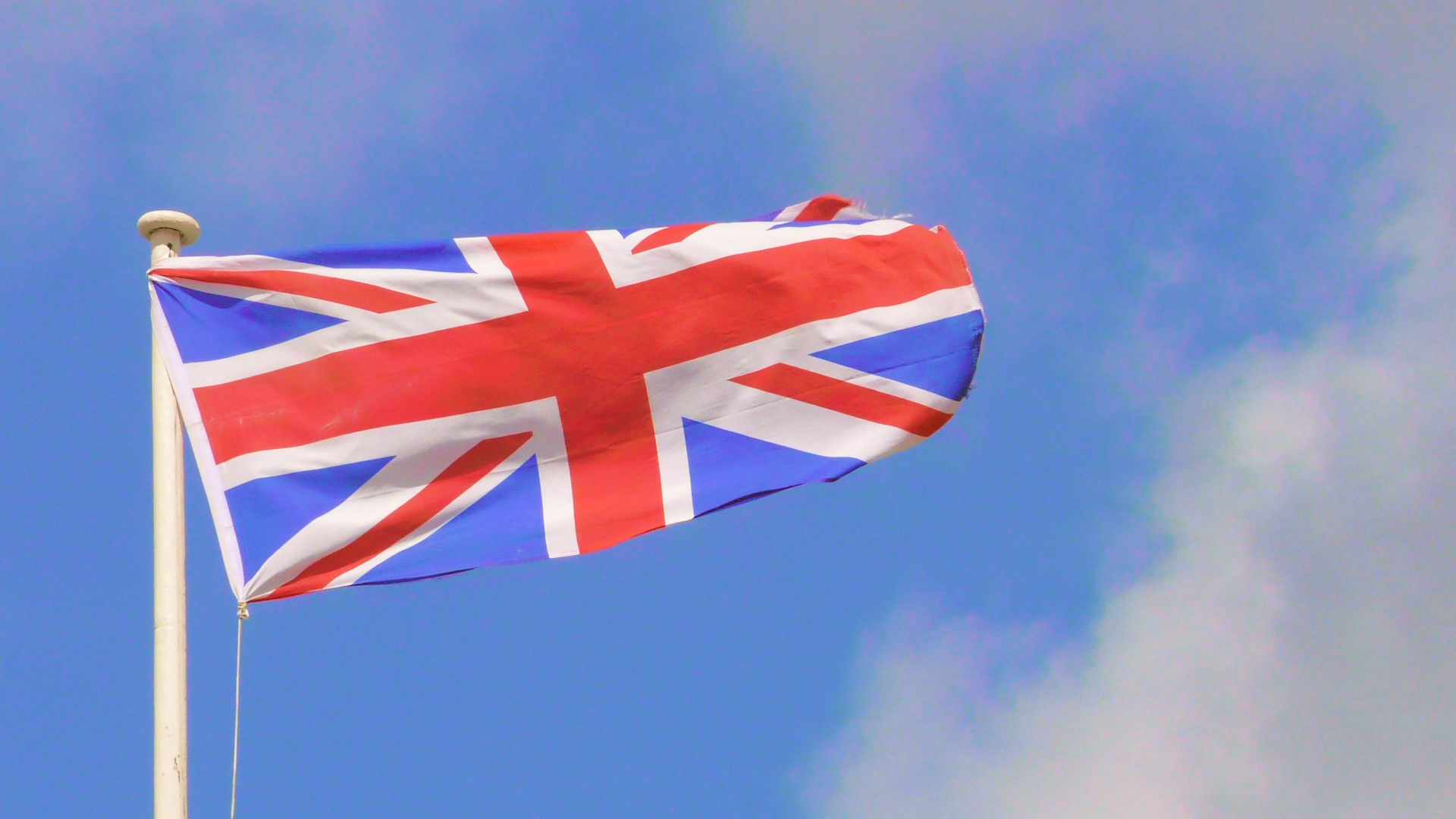 The flag of Great Britain in a blue background.